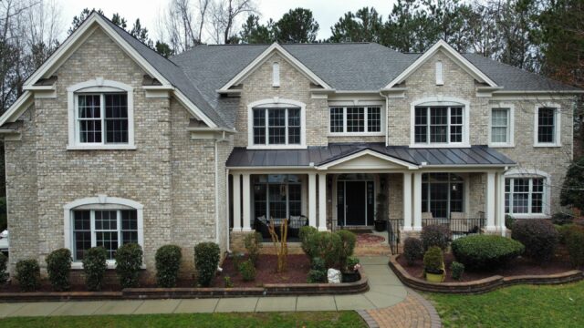 the shingle master shingles and metal front view of home